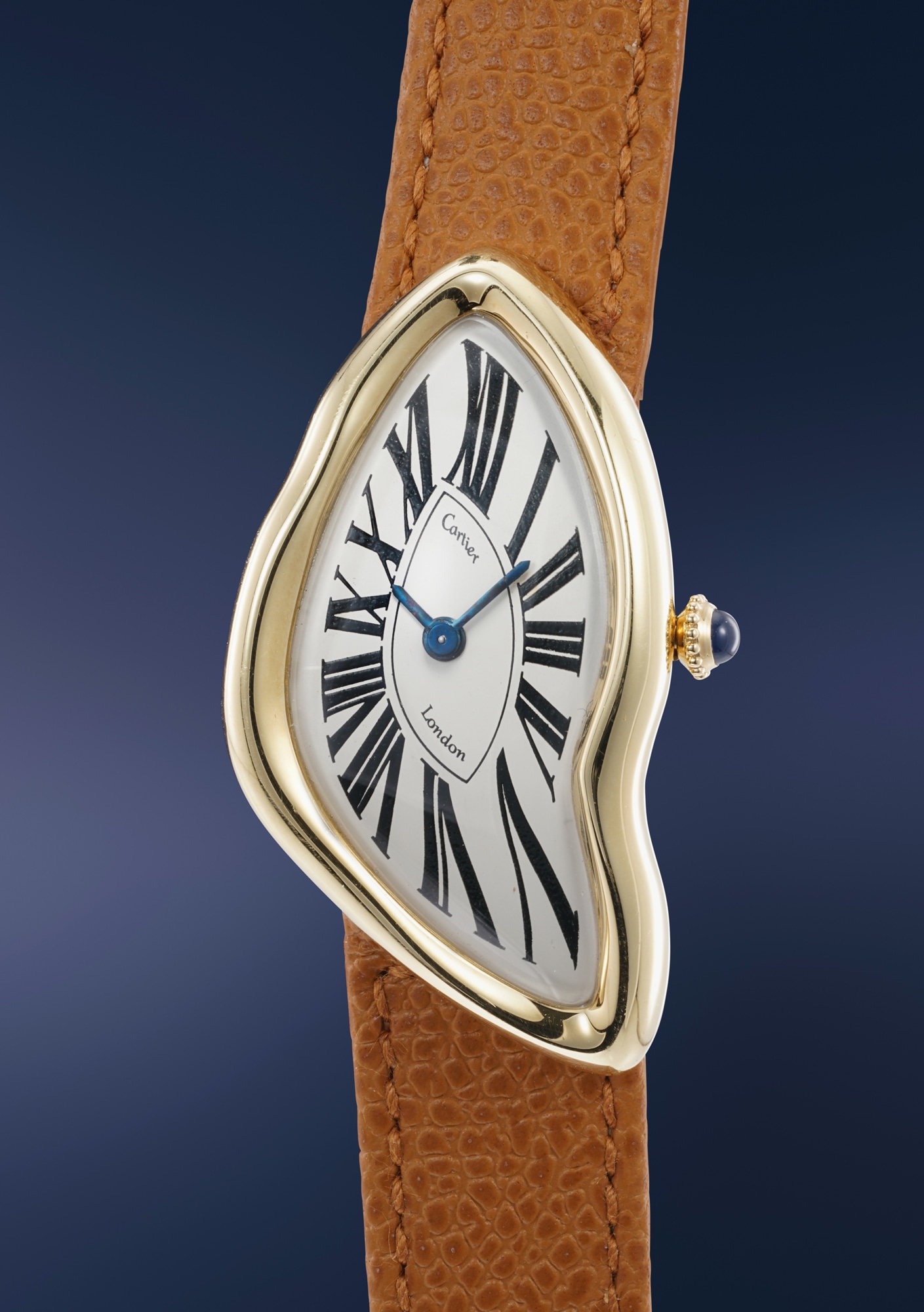 <p><strong>CARTIER</strong>, Crash - An extremely rare, historically important, and early yellow gold asymmetric wristwatch with presentation box, offered by the family of the original owner</p>