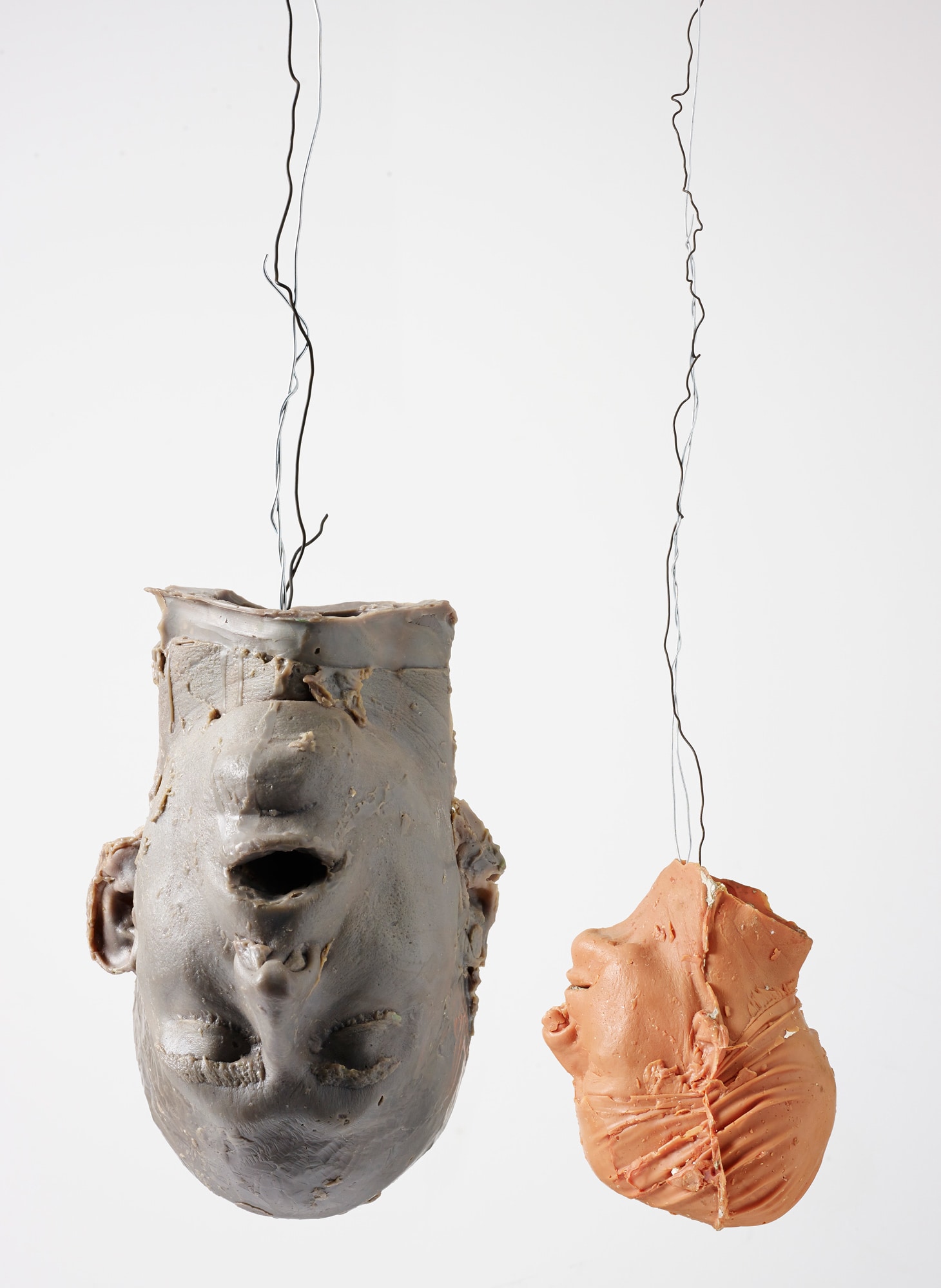 <b>BRUCE NAUMAN</b> <i>Hanging Heads # 1 (Blue Andrew, Mouth Open / Red Julie with Cap),</i> 1989