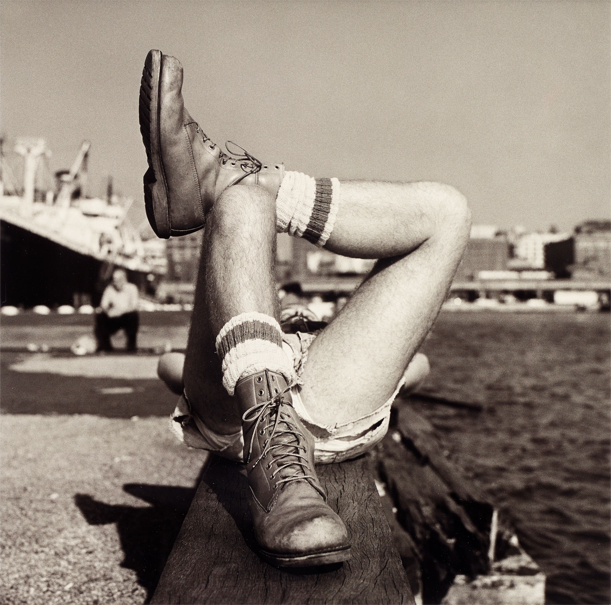 <p><strong>PETER HUJAR</strong> <em>Christopher Street Pier #2 (Crossed Legs)</em></p>