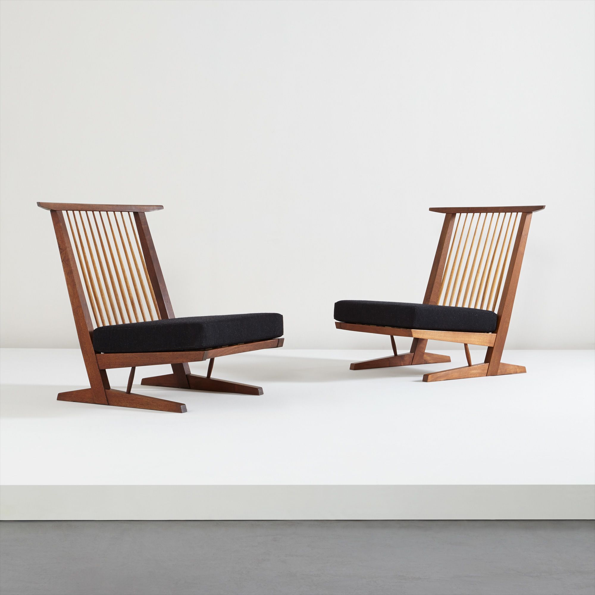 <b>GEORGE NAKASHIMA</b> <i>Pair of 'Conoid Cushion' chairs</i>, 1960s