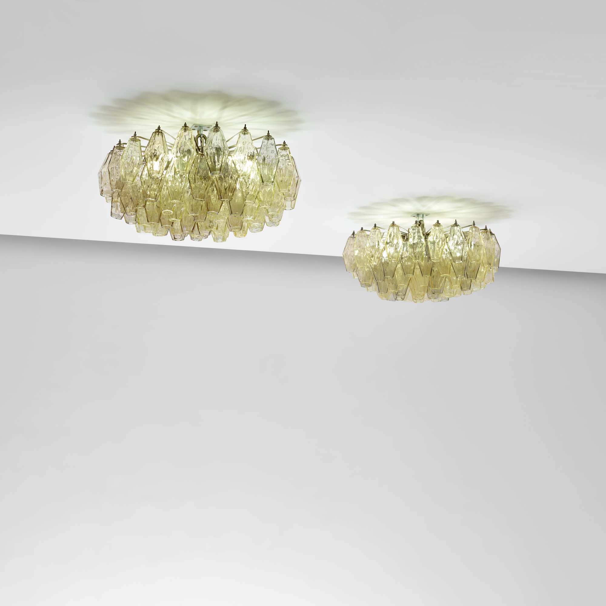 <p><strong>VENINI</strong> <em>Pair of &#39;Poliedri&#39; ceiling lights</em>, circa 1958</p>
