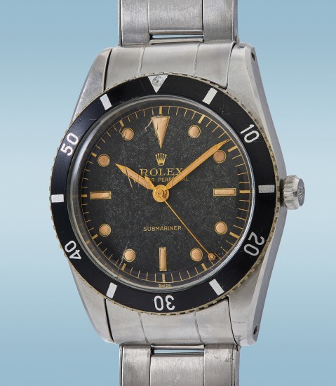 Sold at Auction: Rolex, Rolex Iconic and sporty Submariner 16610 LV of the  50th anniversary, with green rotating bezel, stainless steel with black  dial with luminescent hour markers